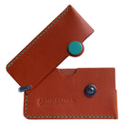 Brown Italian leather magnetic card holder with green button and titanium D-ring
ArtisLeather 