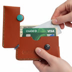 Brown Italian leather magnetic card holder with green button and titanium D-ring
ArtisLeather 