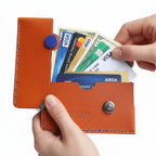 Brown Italian leather magnetic card holder with blue button and titanium D-ring
ArtisLeather 