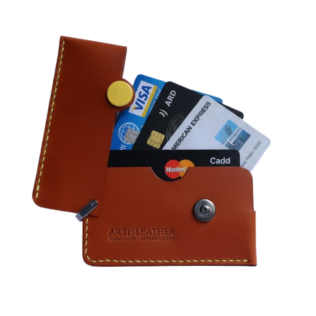 Brown Italian leather magnetic card holder with yellow button and titanium D-ring
ArtisLeather 